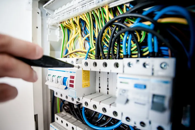 An electrical distribution board being checked